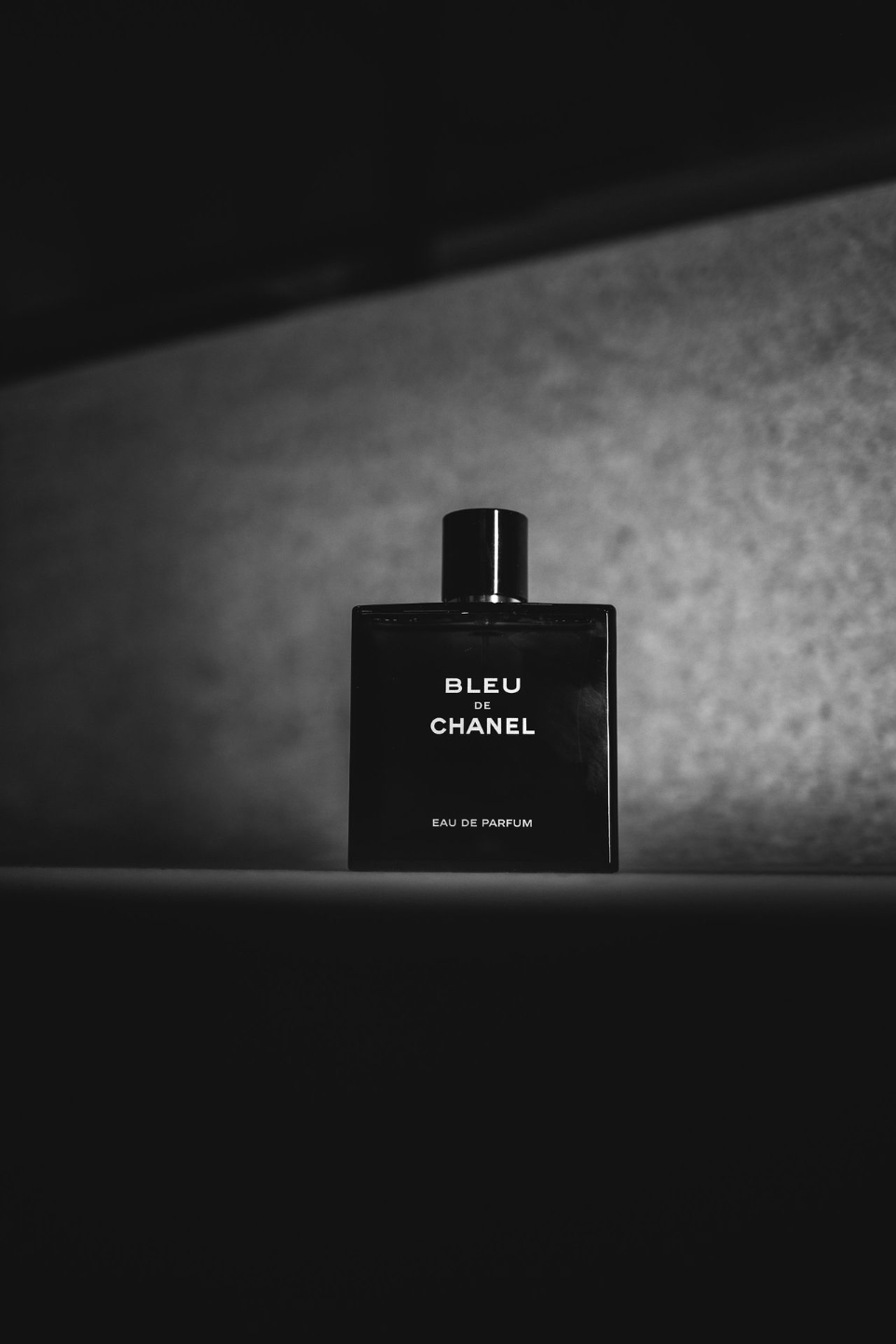 a bottle of perfume sitting on top of a table